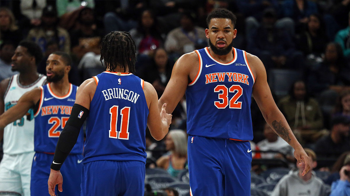 Knicks center Karl-Anthony Towns (32) reacts with guard Jalen Brunson (11) during the third quarter against the Memphis Grizzlies at FedExForum