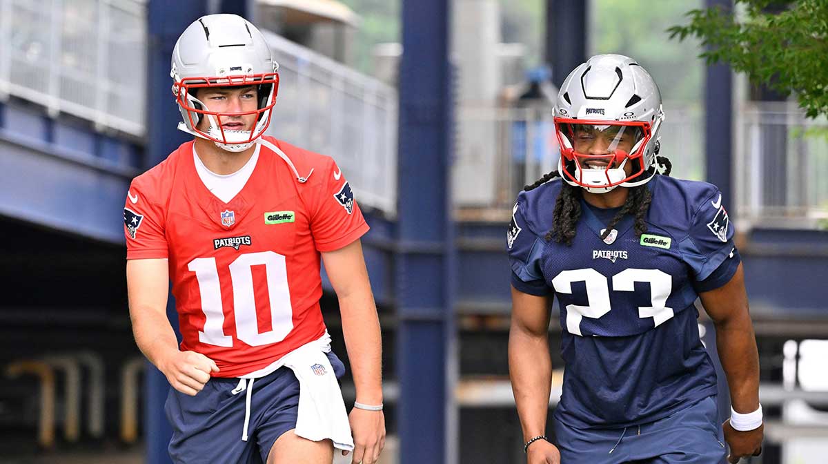 New England Patriots quarterback Drake Maye (10) and safety Kyle Dugger (23) walk to the practice fields at Gillette Stadium.