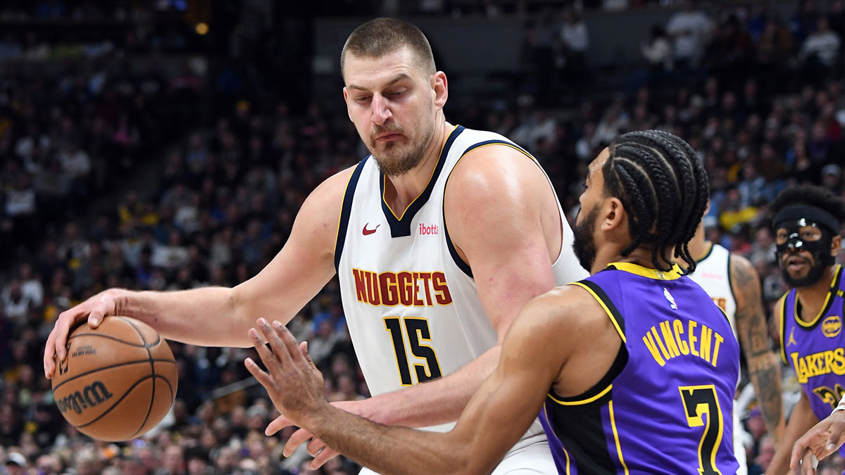Denver Nuggets center Nikola Jokic (15) works in the post against Los Angeles Lakers guard Gabe Vincent (7) during the first half at Ball Arena.