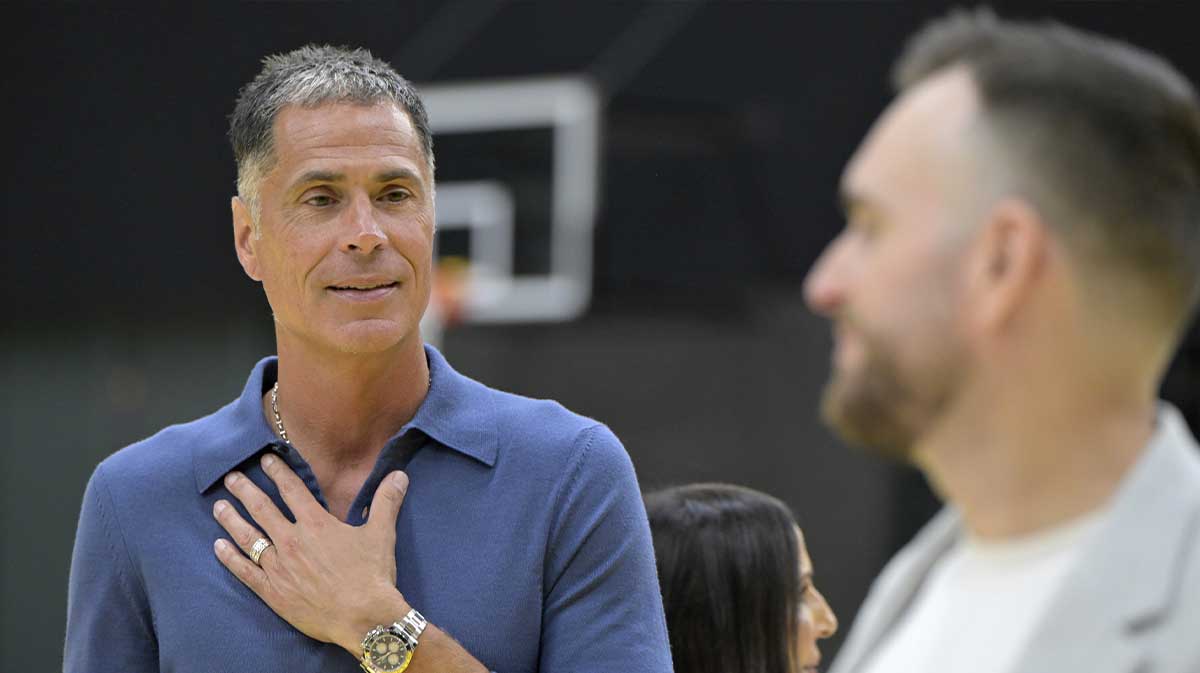 Lakers general manager Rob Pelinka attends a press conference for guard Luka Doncic (77) announcing the signing of a 3-year, $165 million contract extension at UCLA Health Training Center with Lakers guard Luka Doncic in the background