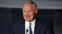 Lakers former player Jerry West speaks at a statue unveiling ceremony for Los Angeles Kings former player Luc Robitaille (not pictured) before the game against the Pittsburgh Penguins at Staples Center