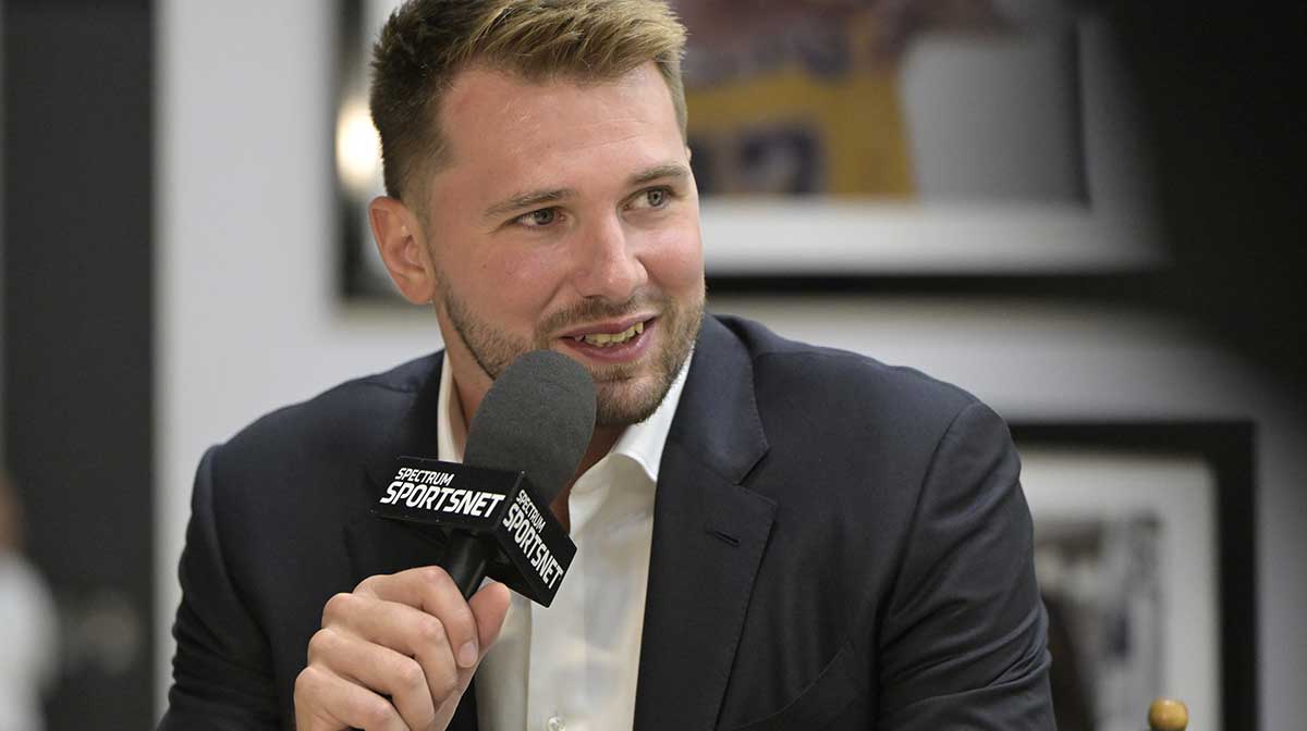Lakers Luka Doncic (77) is interviewed Spectrum SportsNet following a press conference announcing the signing of his contract extension at UCLA Health Training Center