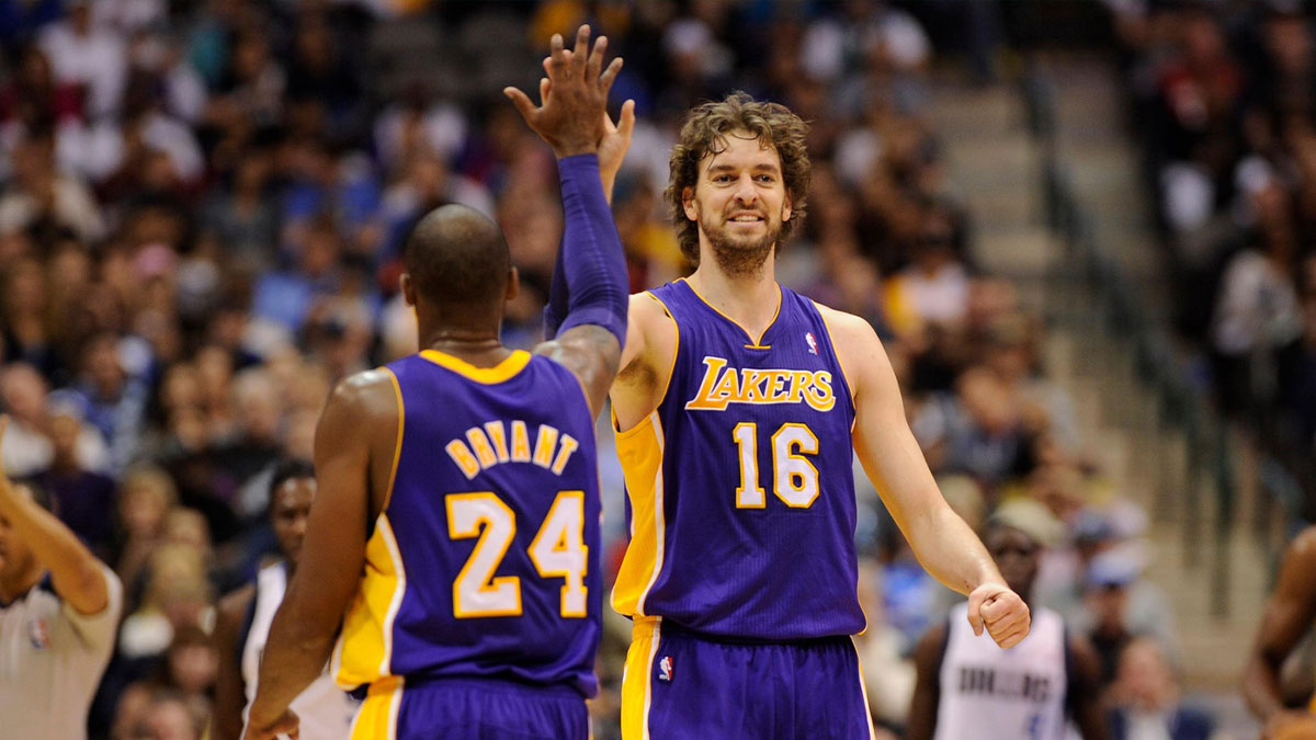 Los Angeles Lakers shooting guard Kobe Bryant (24) and power forward Pau Gasol (16) celebrate during the first half against the Dallas Mavericks at the American Airlines Center.