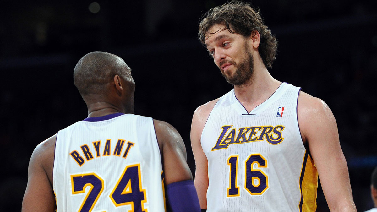 Los Angeles Lakers shooting guard Kobe Bryant (24) and forward Pau Gasol (16) react in the second half against the Sacramento Kings at the Staples Center. Lakers won 103-90.
