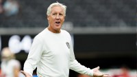 Las Vegas Raiders head coach Pete Carroll reacts to a fan while his team prepares for a preseason game against the San Francisco 49ers at Allegiant Stadium.