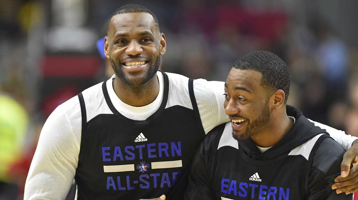 Eastern Conference forward LeBron James of the Cleveland Cavaliers (23) hugs Eastern Conference guard John Wall of the Washington Wizards (2) during practice for the NBA All Star game at Ricoh Coliseum.