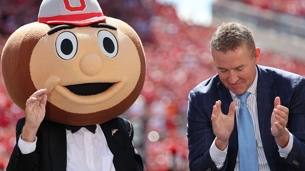 Columbus, Ohio, USA; ESPN's College GameDay host, Lee Corso (left) wears the Ohio State mascot costume during a program before the game at Ohio Stadium.