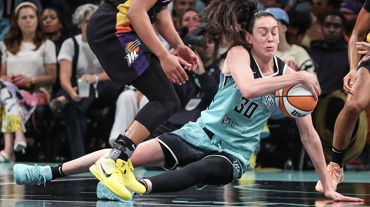 New York Liberty forward Breanna Stewart (30) tries to hold her dribble as she falls to the court in the third quarter against the Phoenix Mercury at Barclays Center.
