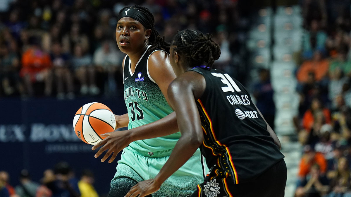 New York Liberty center Jonquel Jones (35) looks to pass the ball against Connecticut Sun center Tina Charles (31) in the second half at Mohegan Sun Arena.
