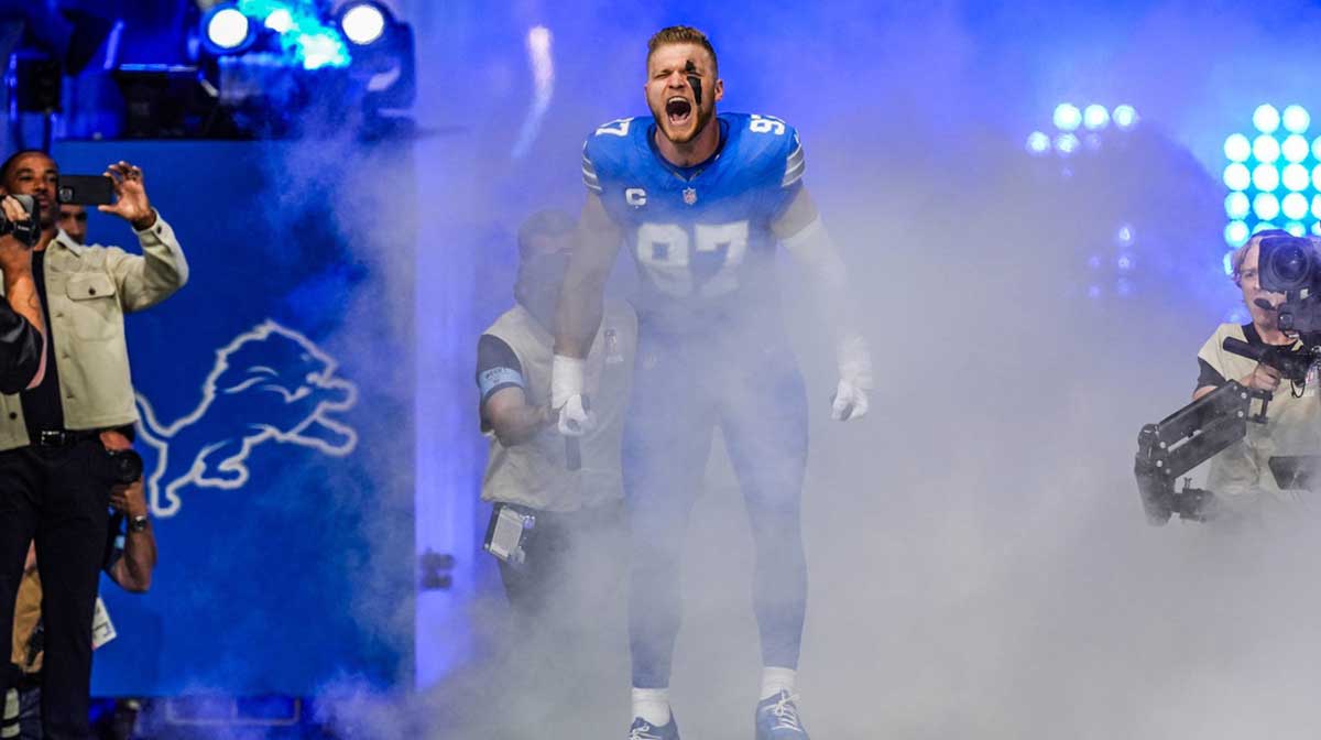 Detroit Lions Aidan Hutchinson (97) runs out of the tunnel during the Detroit Lions season opener against the Los Angeles Rams at Ford Field in Detroit, on Sunday, Sept. 8. 2024.