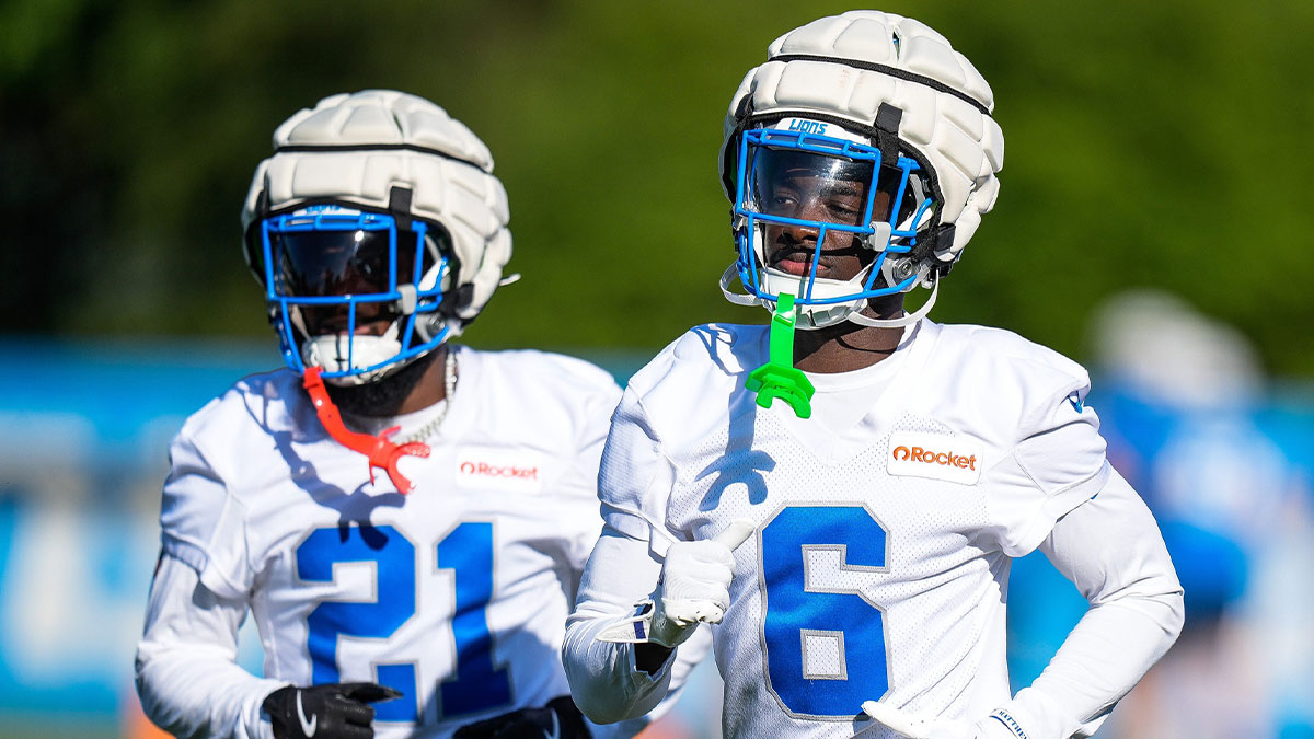 Detroit Lions cornerback Terrion Arnold (6), center, and cornerback Amik Robertson (21) practice during training camp at Meijer Performance Center in Allen Park on Tuesday, July 22, 2025.