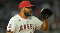 Los Angeles Angels relief pitcher Kenley Jansen (74) earns a save against the Texas Rangers in the ninth inning at Angel Stadium.