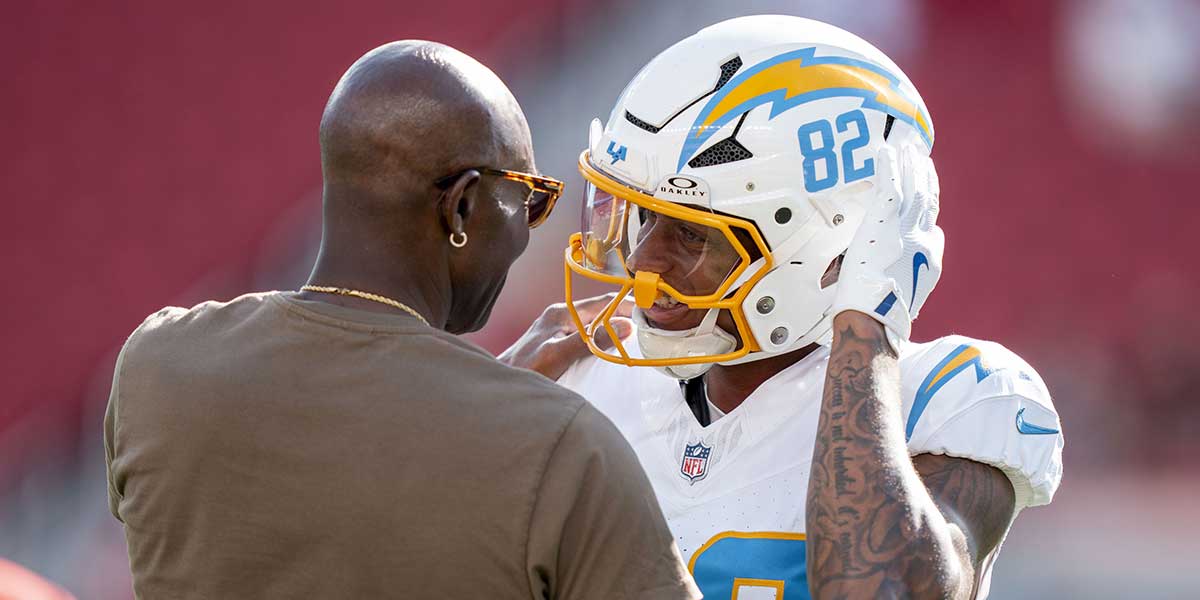Los Angeles Chargers wide receiver Brenden Rice (82) hugs father San Francisco 49ers great Jerry Rice (left) before the game at Levi's Stadium.