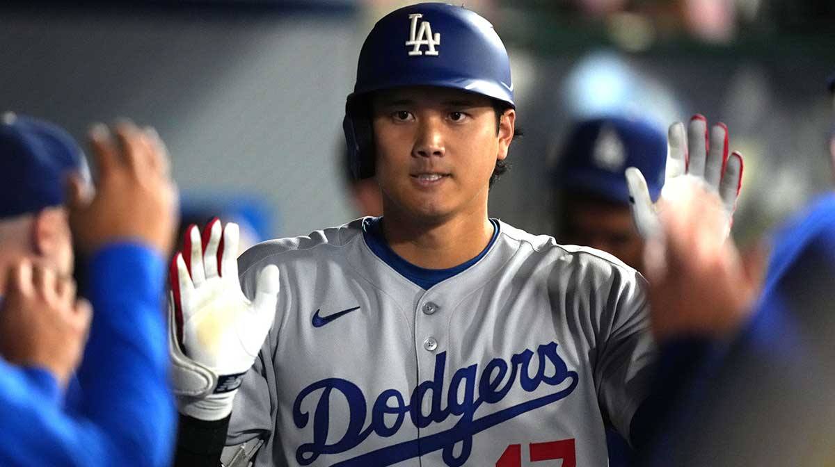 Los Angeles Dodgers designated hitter Shohei Ohtani (17) celebrates with teammates after hitting a home run in the eighth inning against the Los Angeles Angels at Angel Stadium.