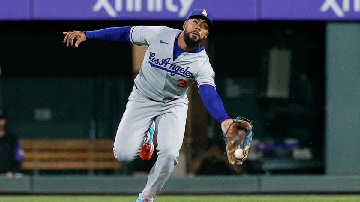 Los Angeles Dodgers right fielder Teoscar Hernandez (37) is unable to make a catch in the ninth inning against the Colorado Rockies at Coors Field.
