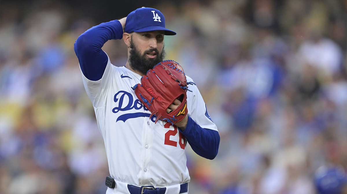 Los Angeles Dodgers pitcher Tony Gonsolin (26) reacts to hitting New York Mets shortstop Francisco Lindor (12) (not pictured) during the first inning at Dodger Stadium.