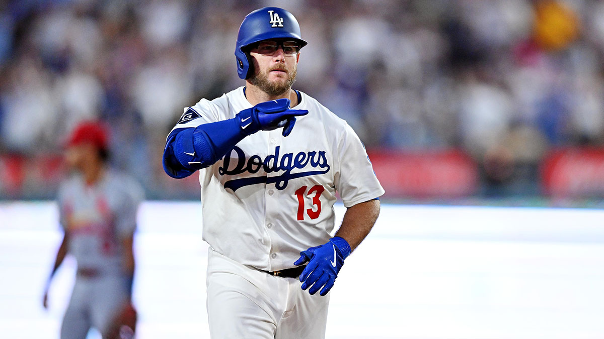 Los Angeles Dodgers third baseman Max Muncy (13) hits a two run home run during the third inning against the St. Louis Cardinals at Dodger Stadium.