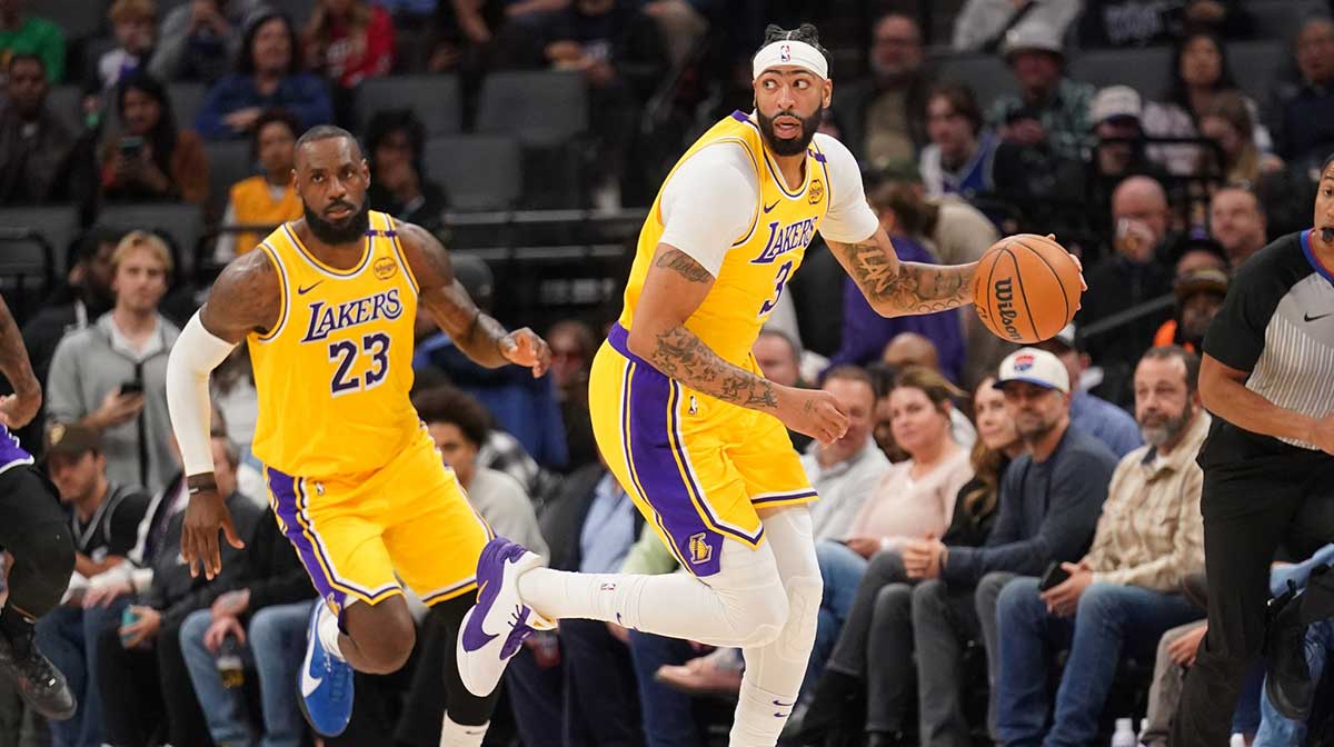 Los Angeles Lakers forward Anthony Davis (3) dribbles the ball next to forward LeBron James (23) against the Sacramento Kings in the first quarter at the Golden 1 Center.