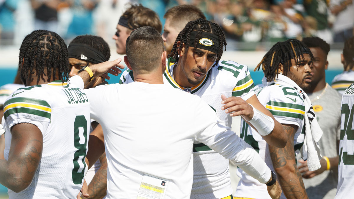 Green Bay Packers quarterback Jordan Love (10) embraces head coach Matt LaFleur before the game against the Jacksonville Jaguars at EverBank Stadium.