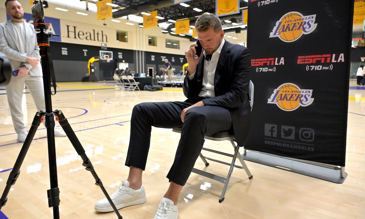Lakers Luka Doncic (77) is interviewed by ESPN LA radio following a press conference announcing the signing of a 3-year, $165 million contract extension at UCLA Health Training Center. 