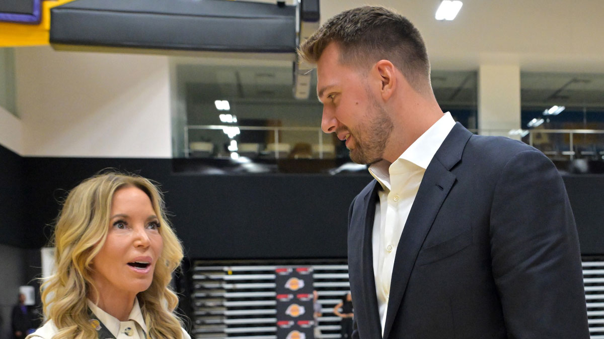 Los Angeles Lakers Luka Doncic (77) talks with team co-owner Jeanie Buss following a press conference announcing the signing of a 3-year, $165 million contract extension