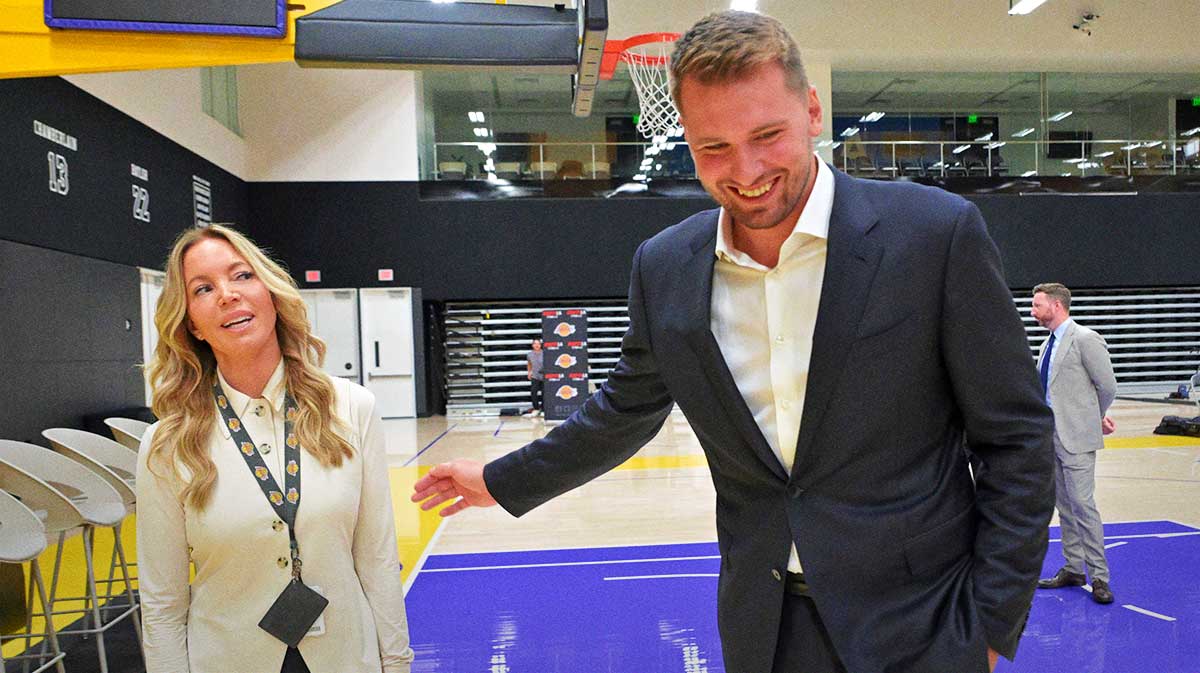 Los Angeles Lakers Luka Doncic (77) talks with team co-owner Jeanie Buss following a press conference announcing the signing of a 3-year, $165 million contract extension at UCLA Health Training Center.