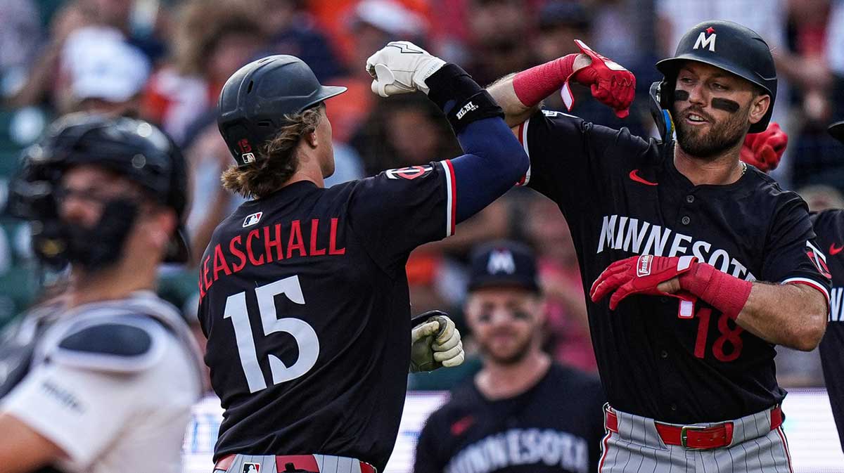 Minnesota Twins second base Luke Keaschall (15), left, celebrates after batting 2-run home run against Detroit Tigers during the first inning at Comerica Park.