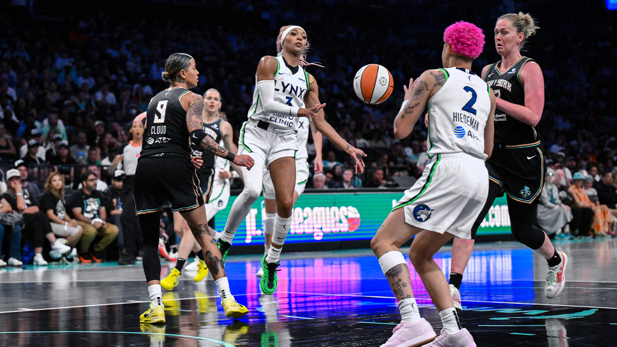 Minnesota Lynx guard DiJonai Carrington (3) passes the ball to guard Natisha Hiedeman (2) as New York Liberty guard Natasha Cloud (9) defends during the second half at Barclays Center.