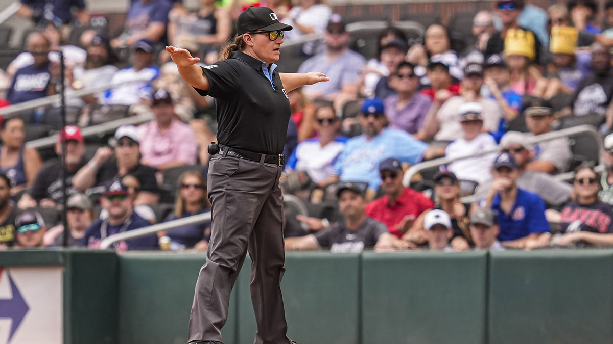 Umpire Jen Pawol (95) makes a safe call during the Atlanta Braves against the Miami Marlins game during the ninth inning at Truist Park.