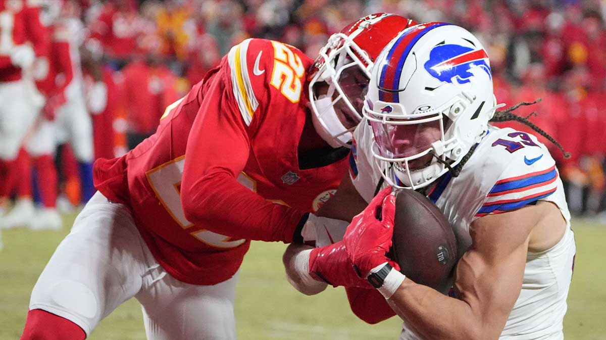 Buffalo Bills wide receiver Mack Hollins (13) makes a catch for a touchdown against Kansas City Chiefs cornerback Trent McDuffie (22) during the first half in the AFC Championship game at GEHA Field at Arrowhead Stadium.