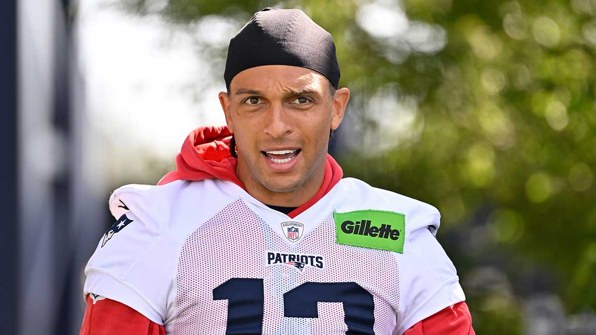 New England Patriots wide receiver Mack Hollins (13) walks to the practice fields for training camp at Gillette Stadium.