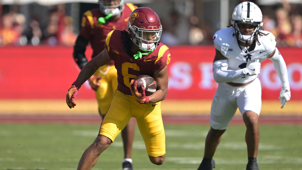 USC Trojans wide receiver Makai Lemon (6) carries the ball for a first down in the second half against the Penn State Nittany Lions at United Airlines Field at the Los Angeles Memorial Coliseum.