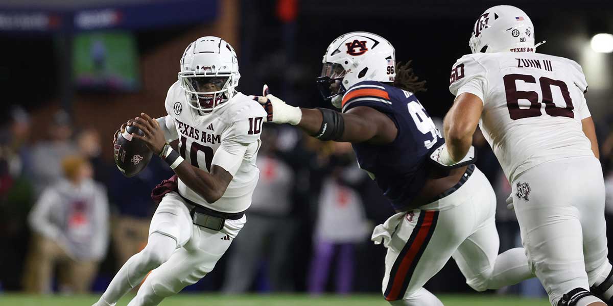 Texas A&M Aggies quarterback Marcel Reed (10) tries to avoid the tackle of Auburn Tigers defensive lineman Philip Blidi (96) during the first quarter at Jordan-Hare Stadium.