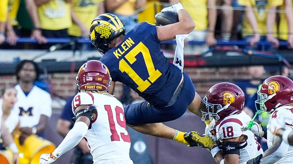Michigan tight end Marlin Klein (17) tries to jump over USC cornerback John Humphrey (19) during the second half at Michigan Stadium