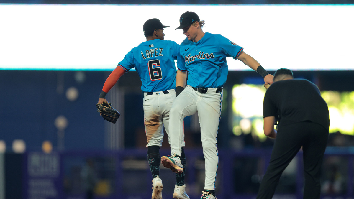 Miami Marlins shortstop Otto Lopez (6) and Miami Marlins left fielder Kyle Stowers (28) celebrate after winning the game against the New York Yankees at loanDepot Park.