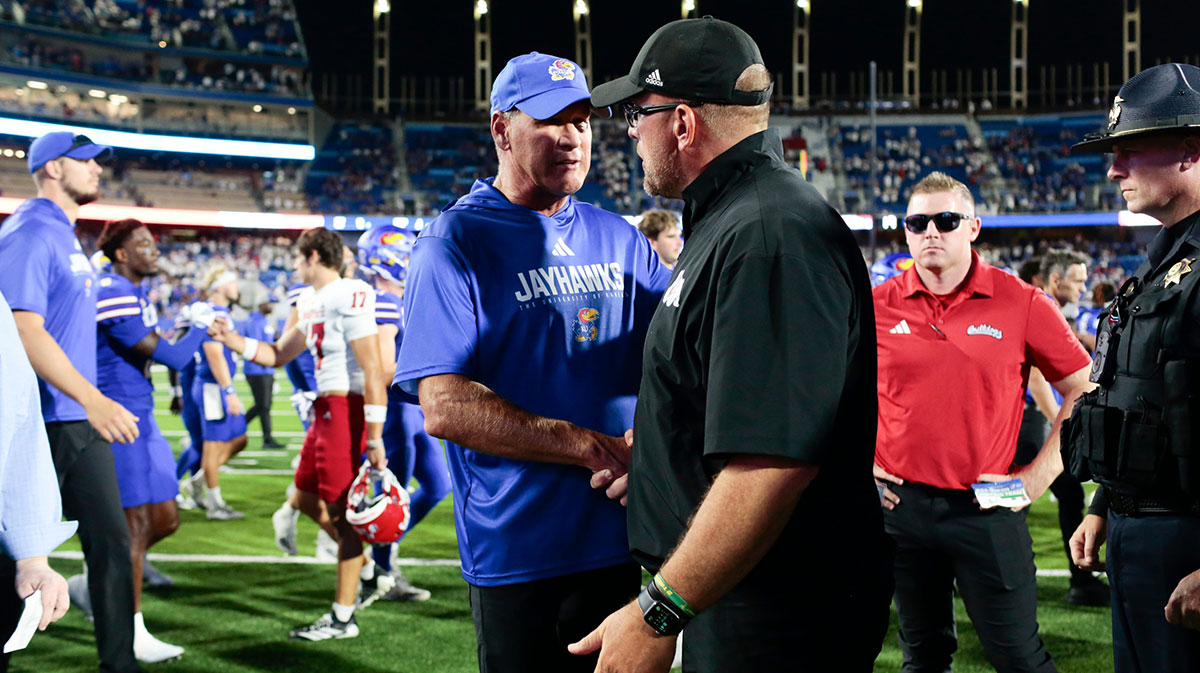 Kansas Jayhawks head coach Lance Leipold shakes hands with Fresno State Bulldogs head coach Matt Entz after the game between Fresno State and Kansas at David Booth Kansas Memorial Stadium on Aug. 23, 2025