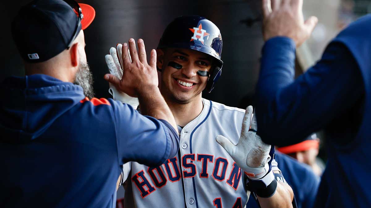 Houston Astros second baseman Mauricio Dubón (14) celebrates in the dugout after hitting a one-run home run during the fourth inning against the Athletics at Sutter Health Park.