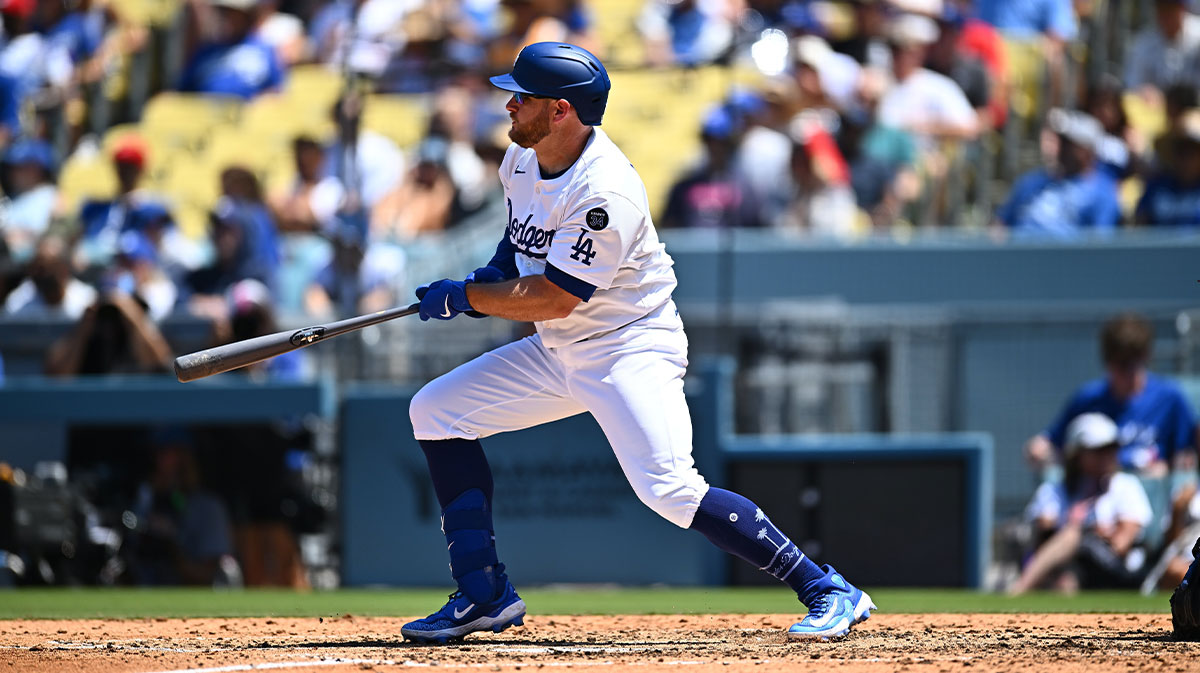 Los Angeles Dodgers third baseman Max Muncy (13) singles during the third inning against the Toronto Blue Jays at Dodger Stadium.