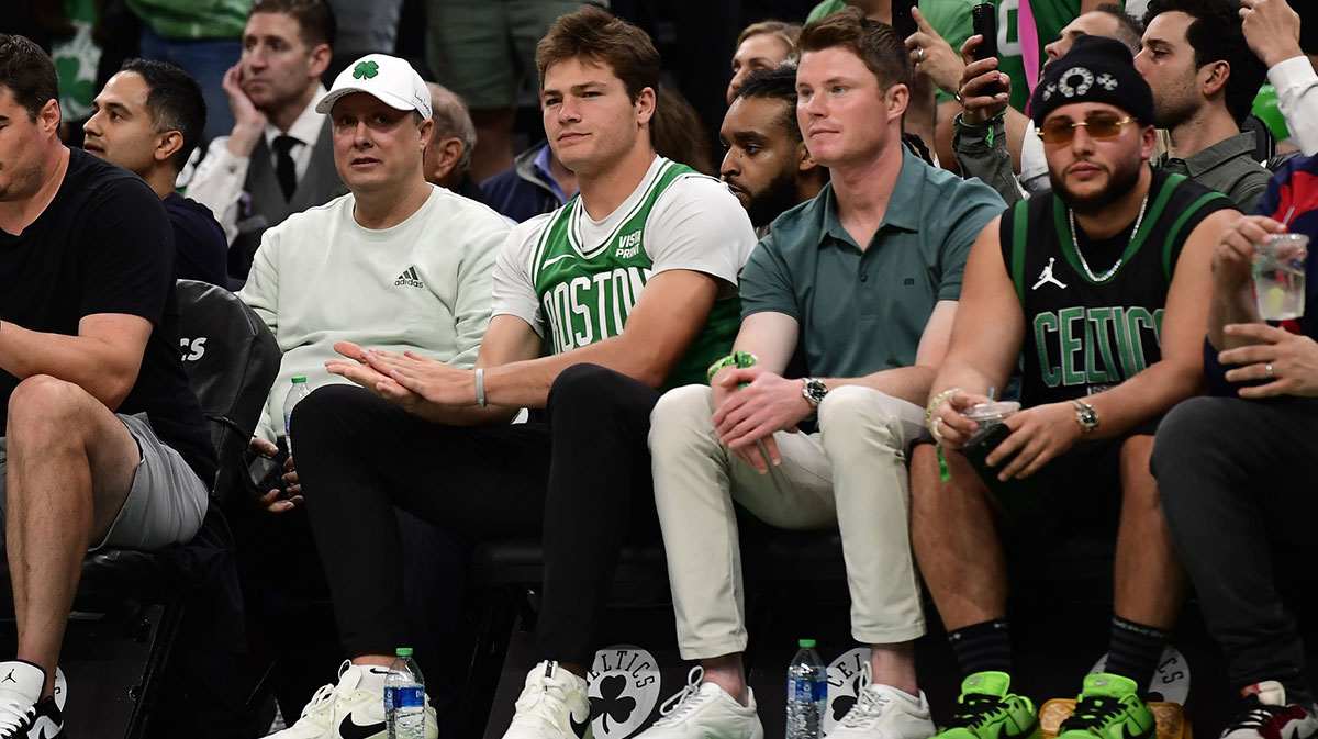 New England Patriot QB Drake Maye watches during the first half for game one of the eastern conference finals for the 2024 NBA playoffs at TD Garden.