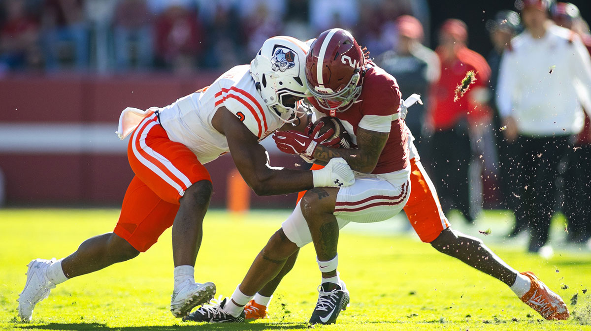 Mercer Bears linebacker Isaac Dowling (3) tackles Alabama Crimson Tide wide receiver Ryan Williams (2) during the first quarter at Bryant-Denny Stadium