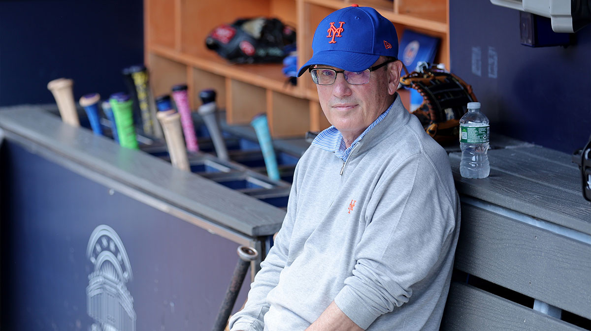 New York Mets owner Steve Cohen sits in the dugout after batting practice before a game against the New York Yankees at Yankee Stadium.