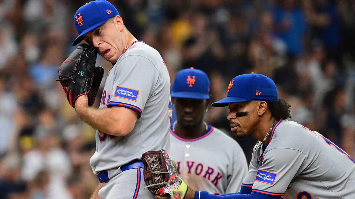 Mets pitcher Ryan Helsley (56) reacts during a pitching change