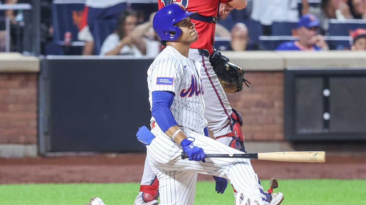 Mets right fielder Juan Soto (22) kneels at home plate