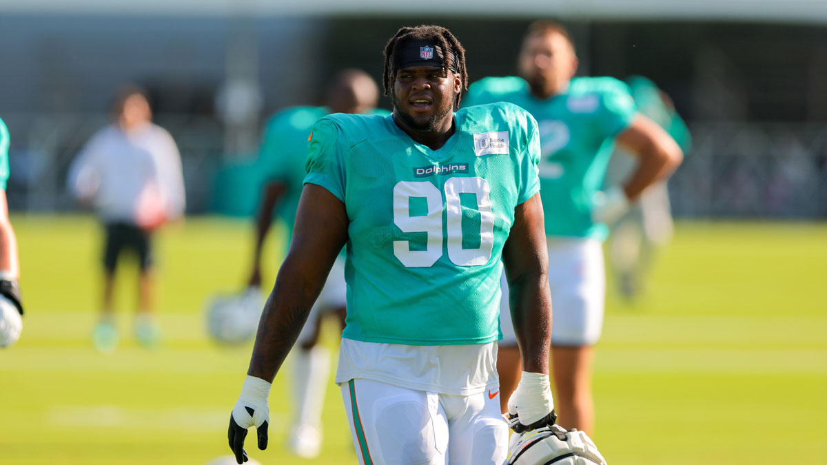 Miami Dolphins defensive tackle Kenneth Grant (90) looks on from the field during training camp at Baptist Health Training Complex.