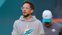 Miami Dolphins head coach Mike McDaniel enters the field before the game against the Jacksonville Jaguars at Hard Rock Stadium.