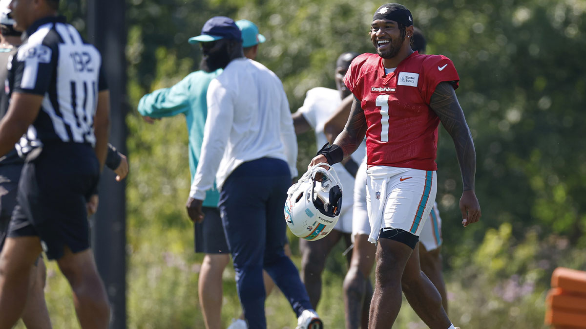 Miami Dolphins quarterback Tua Tagovailoa (1) walks on the field during joint training camp practice with the Chicago Bears ahead of Sunday's preseason opener.