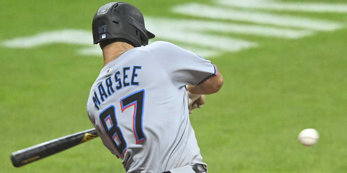 Aug 13, 2025; Cleveland, Ohio, USA; Miami Marlins center fielder Jakob Marsee (87) hits a two-run double in the sixth inning against the Cleveland Guardians at Progressive Field. Mandatory Credit: David Richard-Imagn Images