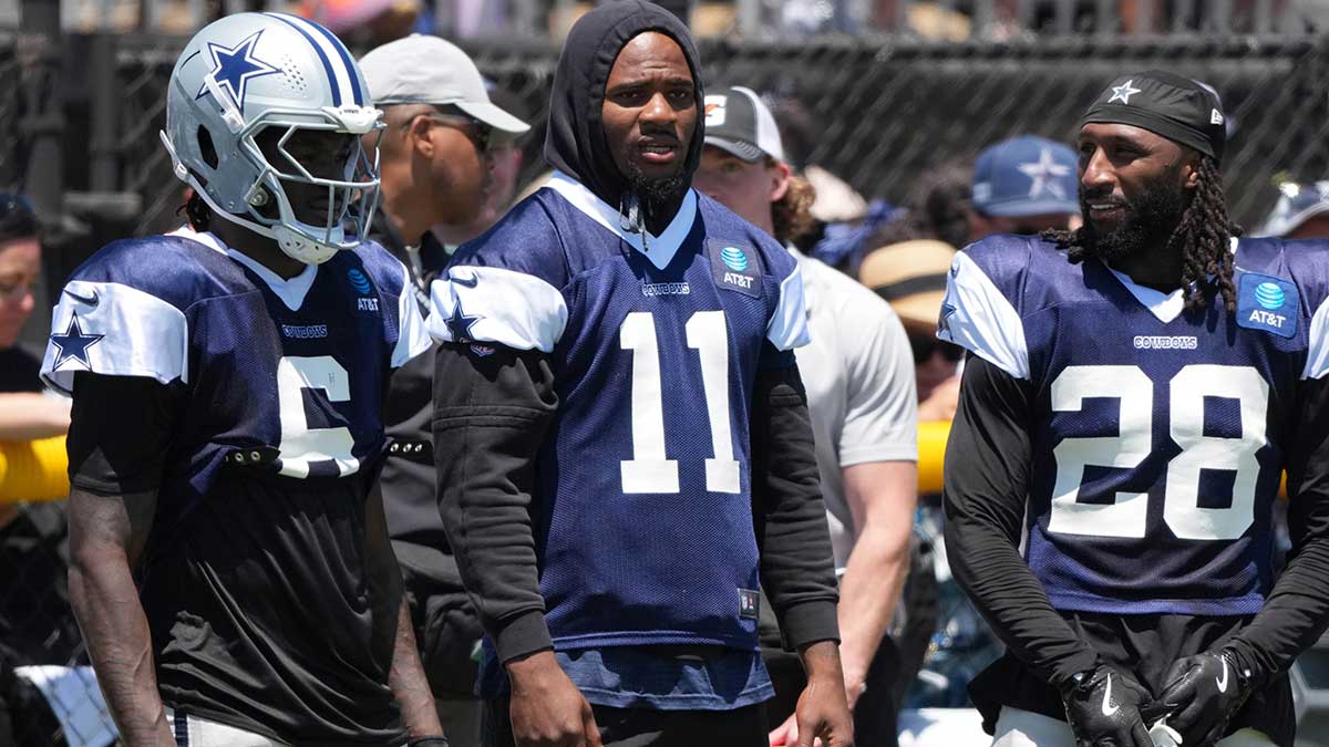 Dallas Cowboys safety Donovan Wilson (6), defensive end Micah Parsons (11) and safety Malik Hooker (28) watch from the sidelines at training camp at the River Ridge Fields.