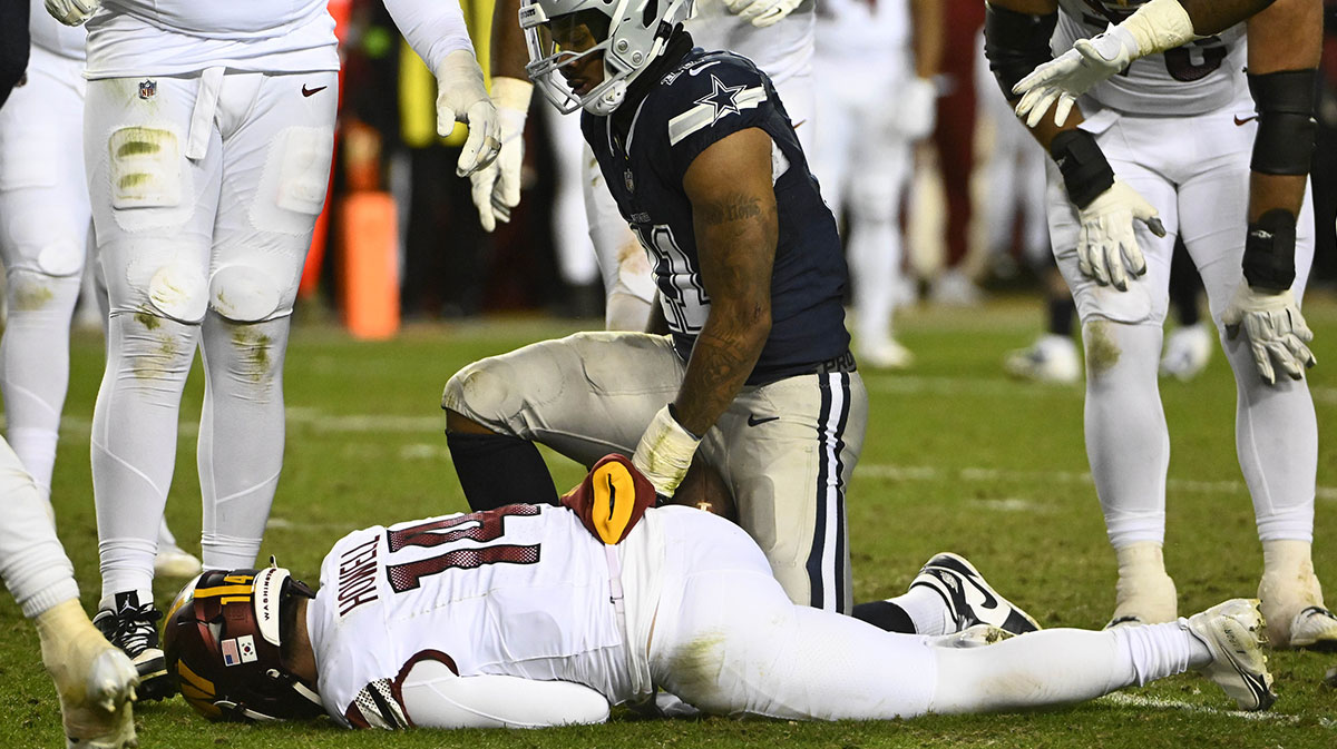 Dallas Cowboys linebacker Micah Parsons (11) sacks Washington Commanders quarterback Sam Howell (14) during the second half at FedExField.