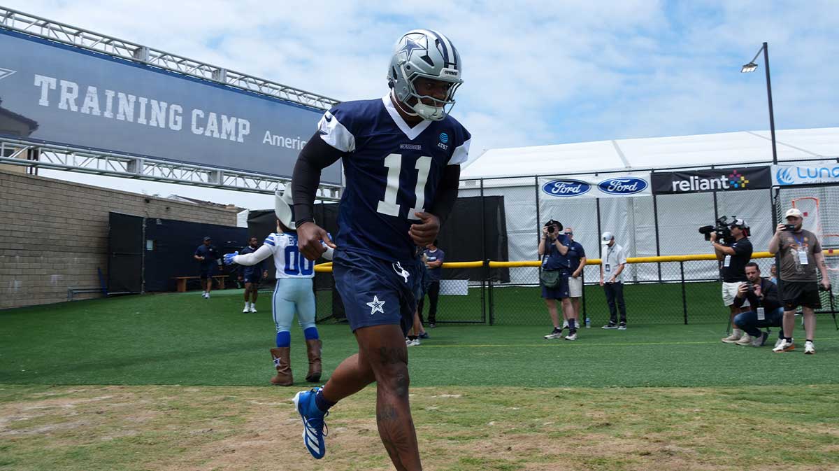 Caption:Jul 22, 2025; Oxnard, CA, USA; Dallas Cowboys defensive end Micah Parsons (11) enters the field during training camp at the River Ridge Fields.